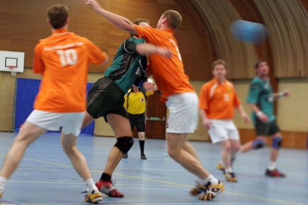 Why do handball passing errors occur under pressure?